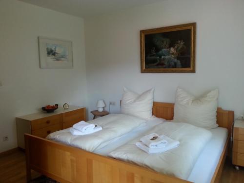 a bedroom with two beds with towels on them at Ferienwohnung Halder, Ihr Bett im Allgäu in Bad Hindelang