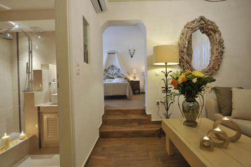 a living room with a staircase leading to a bedroom at Villa Isabella in Naousa
