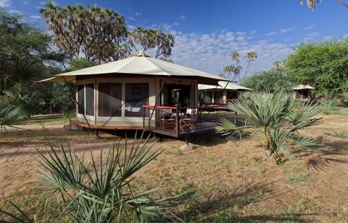 a gazebo with a tent in a field at Ashnil Samburu Camp in Archers Post