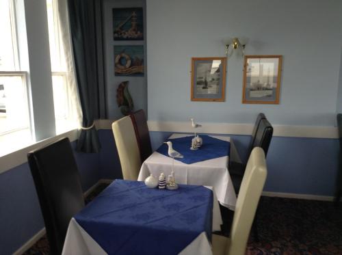 A restaurant or other place to eat at The Nelson Hotel 