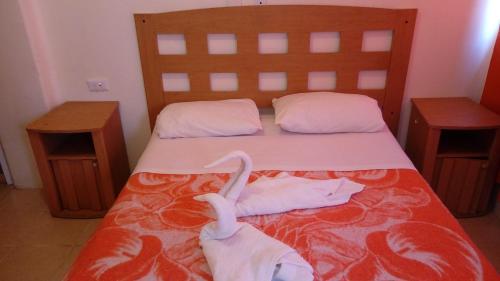Postel nebo postele na pokoji v ubytování Hotel Patria