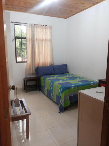 Postel nebo postele na pokoji v ubytování Hotel Orinoco Real