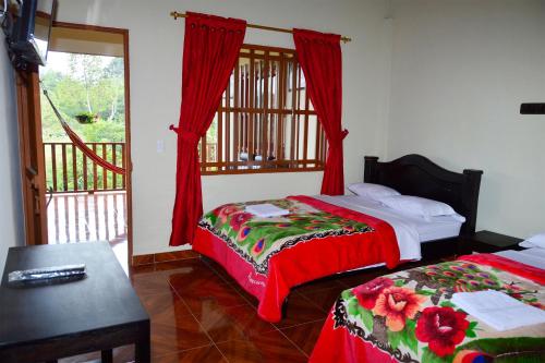 Katil atau katil-katil dalam bilik di Hospedaje y Camping Buena Vista