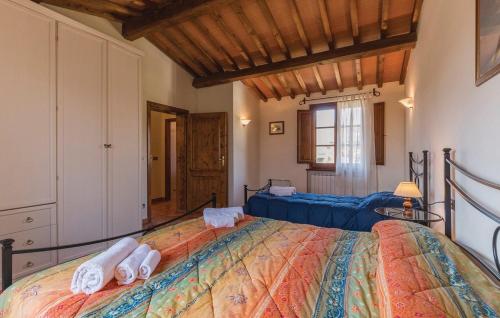 a bedroom with a large bed with towels on it at Borgo Nuovo San Martino in Ambra