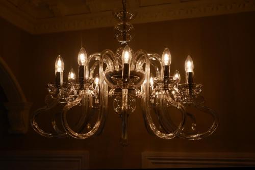 a chandelier hanging from a ceiling in a room at The Devon Court in Torquay