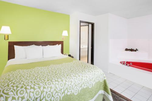 Ένα ή περισσότερα κρεβάτια σε δωμάτιο στο Days Inn by Wyndham York
