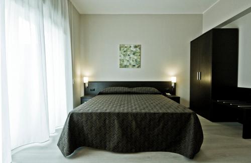 a bedroom with a bed and a piano at Guest House Residence in Messina