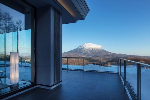 a view of a mountain from the balcony of a house at Aya Niseko in Kutchan