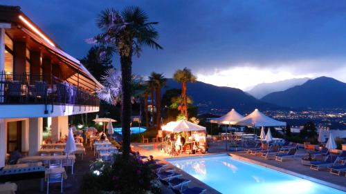 a hotel with a swimming pool and a resort at Hotel La Campagnola - Green Energy Resort in San Nazzaro