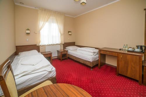 Voodi või voodid majutusasutuse Hotel Grant toas