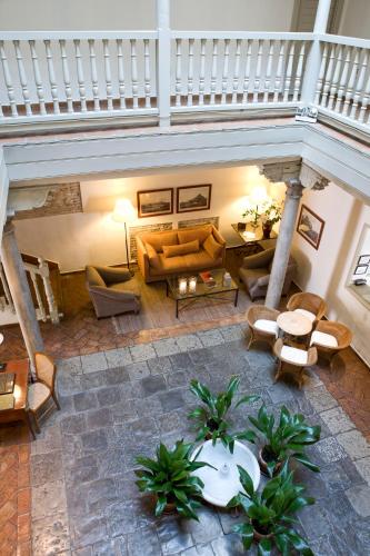 an overhead view of a living room with couches and tables at Palacio De Los Navas in Granada