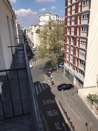 a view of a street from a balcony of a building at Grand Hotel Nouvel Opera in Paris