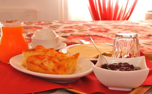 a table with a plate of food on a table at Al Filò in Marostica