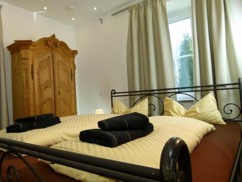 Postel nebo postele na pokoji v ubytování LakeStarnberg Apartments