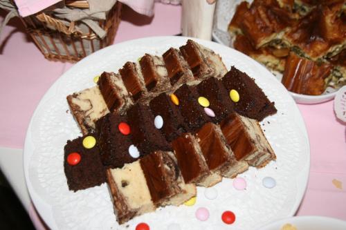 a white plate with a piece of cake on a table at Boutique Hotel Kentrikon & Bungalows in Agios Ioannis Pelio