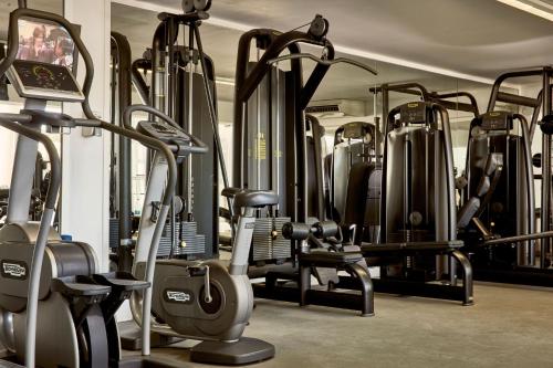 a gym with a bunch of treadms and machines at Grecian Park in Protaras