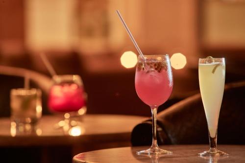 two glasses of drinks sitting on a table at Grecian Park in Protaras