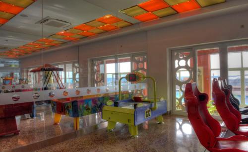 a childrens play room with a table and chairs at Hotel & Spa Entremares in La Manga del Mar Menor
