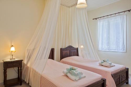 Postel nebo postele na pokoji v ubytování Mata's Apartments