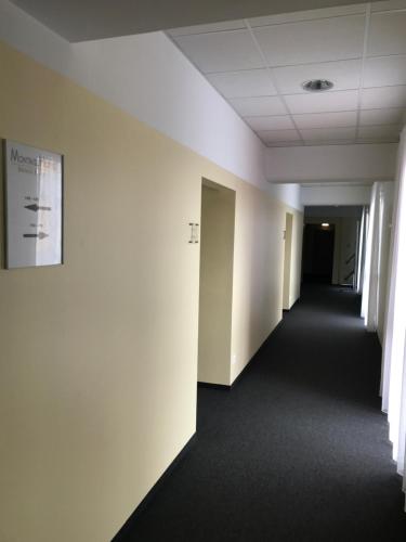 an empty hallway in an office building at Business & City in Linz