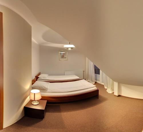 Säng eller sängar i ett rum på Apartamenty Pod Telegrafem