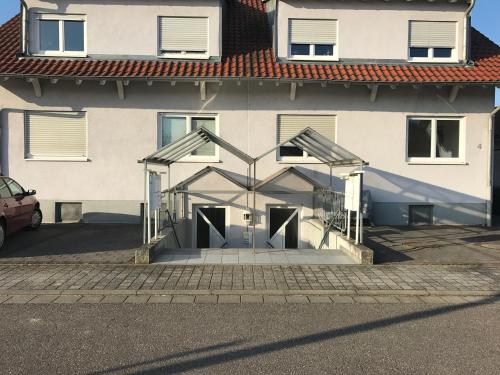 a building with its doors open in a parking lot at Victoria Appartement in Kappel-Grafenhausen