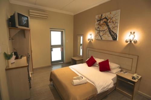 Katil atau katil-katil dalam bilik di Minen Hotel