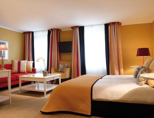 En eller flere senger på et rom på Saillant Hotel Gulpenerland - Auping Hotel Partner