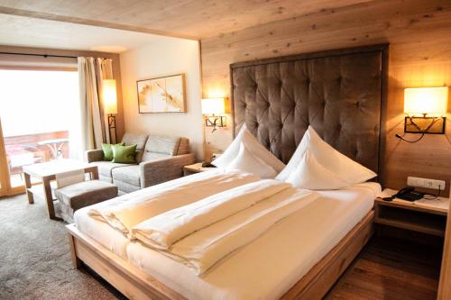 En eller flere senge i et værelse på Hotel Bogner Hof
