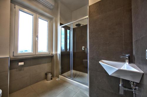 a bathroom with a sink and a shower at lepini suites affittacamere in Patrica