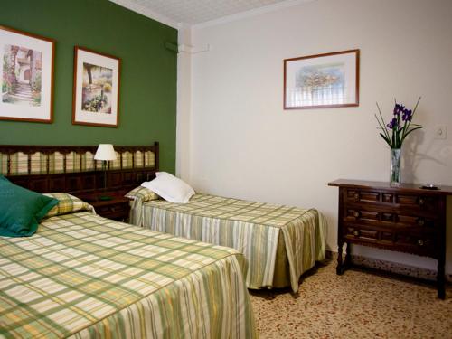 Säng eller sängar i ett rum på Hotel Costa