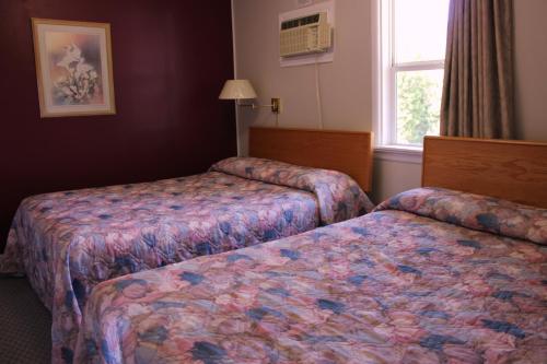 Postel nebo postele na pokoji v ubytování Boundary Motel