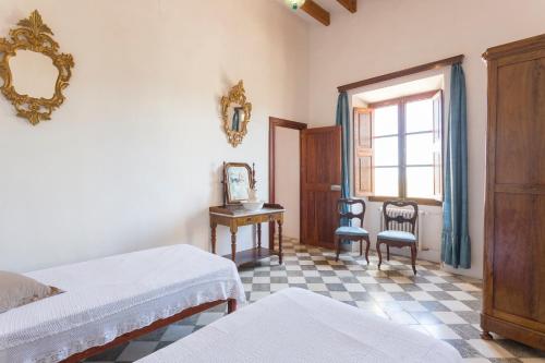 Katil atau katil-katil dalam bilik di Agroturismo Son Sant Andreu