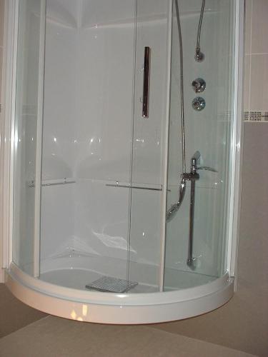 a shower with a glass enclosure in a bathroom at Chambres D'hôtes Bel'vue in Chauvigny