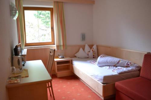 Säng eller sängar i ett rum på Gasthof Alpenblick
