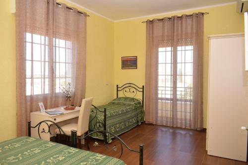Voodi või voodid majutusasutuse B&B Vico Napoli Salento toas