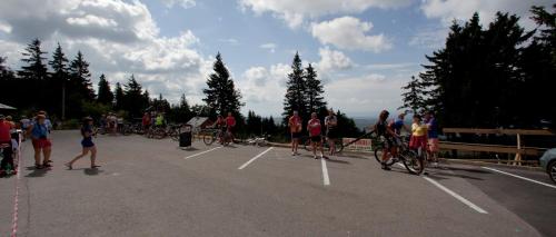 a group of people riding bikes in a parking lot at Kramářova chata in Orličky