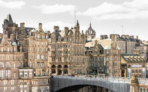 a bridge over a city with buildings at The Scotsman Hotel in Edinburgh