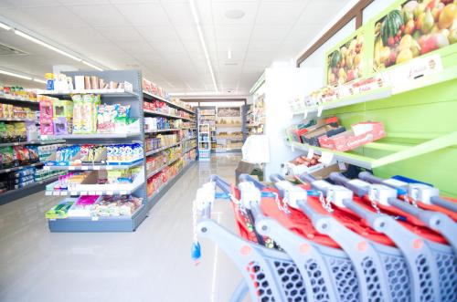 a store aisle with chairs in a supermarket at Mar de Pulpí Las Azucenas by Mar Holidays in San Juan de los Terreros