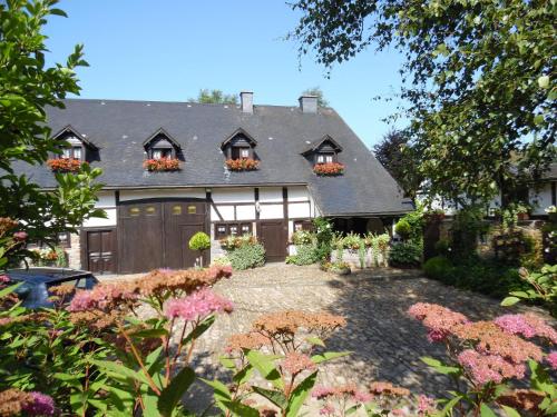 an exterior view of a house with a garden at Cozy Cottage in Malmedy with Large Garden in Malmedy