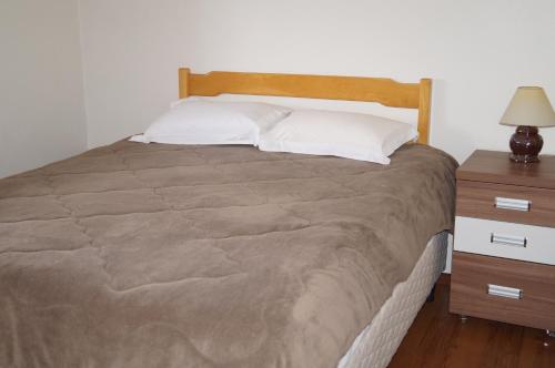 
Cama ou camas em um quarto em Apartamento no centro de Canela
