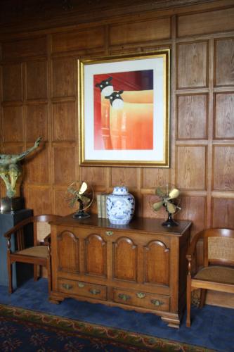 a room with a table and two chairs and a picture at The Wrea Head Hall Country House Hotel & Restaurant in Scarborough