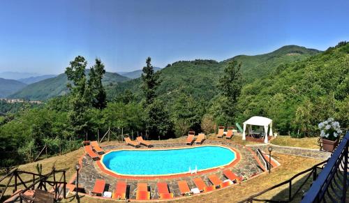 a swimming pool in the middle of a mountain at Agriturismo Bicocchi in Piteglio