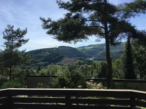 a bench with a view of a mountain at Modern Holiday Home in Stavelot with Terrace in Stavelot