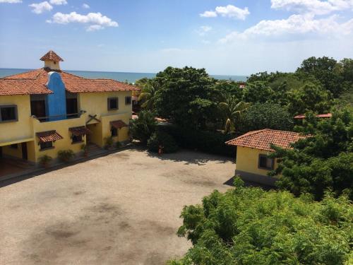 an aerial view of a house with a yard at Solyar Luxury Spanish Beachfront Home in Pochomil