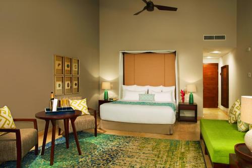 Una cama o camas en una habitación de Dreams Dominicus La Romana Resort & Spa