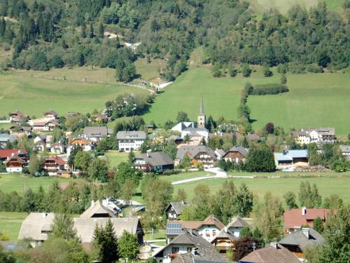 a small town in the mountains with houses and trees at Bauernhof Trinkergut in Unternberg