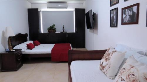 Cama o camas de una habitación en Arco Apartasuites