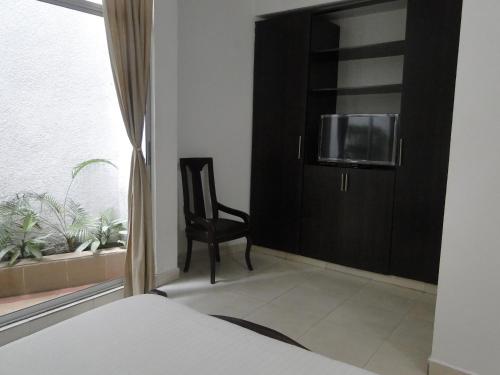 Cama o camas de una habitación en Arco Apartasuites