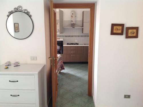a kitchen with a door leading into a room at Villa Maria Antonietta in Vietri sul Mare